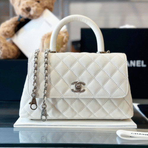 Untitled-design-2025-05-28T175055.339 Chanel Coco Handbags Leather White With Silver Lock Woman’s 23cm