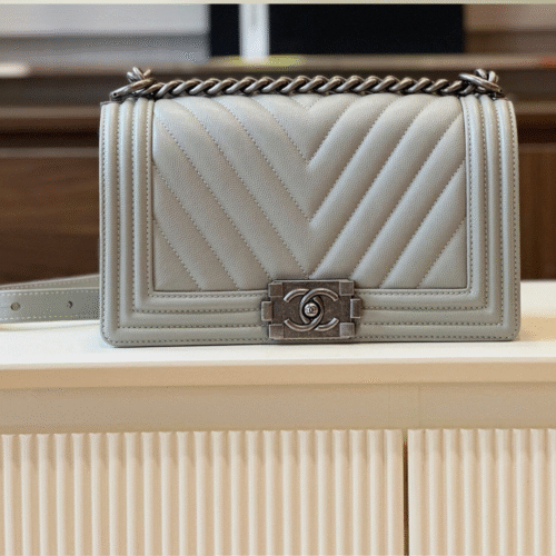 Untitled-design-2025-05-28T232239.121 Chanel Boy Medium Handbags Grey Leather With Silver Lock 25cm