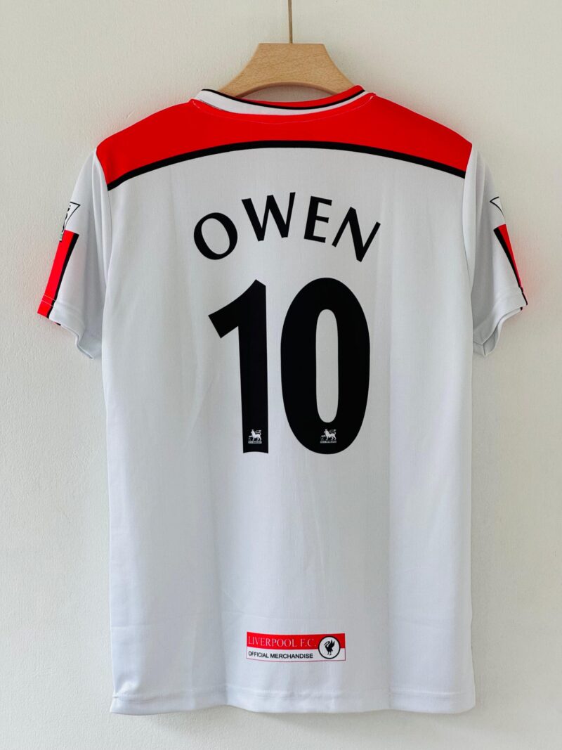 rn-image_picker_lib_temp_180a71bf-9c7d-4f44-b808-01cb9591f8eb Celebrate Owen’s Explosive Brilliance with the 1998-99 Liverpool FC Away Jersey – Embroidery Edition