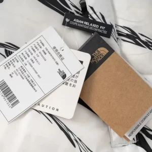 Replica The North Face Zebra Down Jacket Black White Reps - RepLuxe